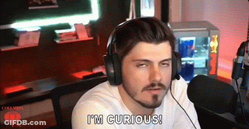 Man Wearing Headphones Says I'm Curious In Front Of Red Bull Cooler GIF