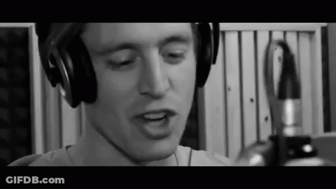 Man Wearing Headphones Singing Into Microphone GIF