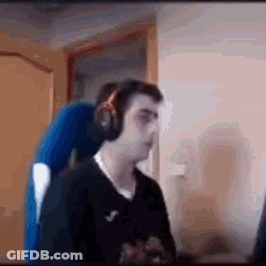 Man Wearing Headphones Sitting At Computer GIF