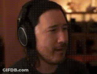 Man Wearing Headphones Sitting At Microphone GIF