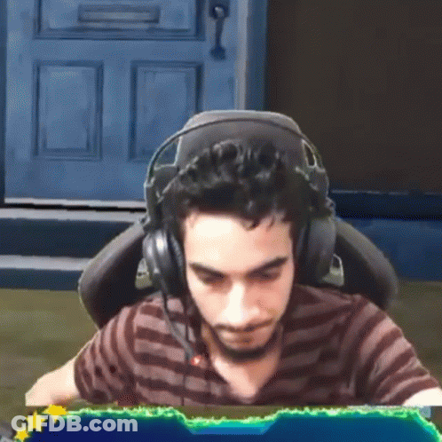 Man Wearing Headphones Sitting In Front Of Computer Screen GIF