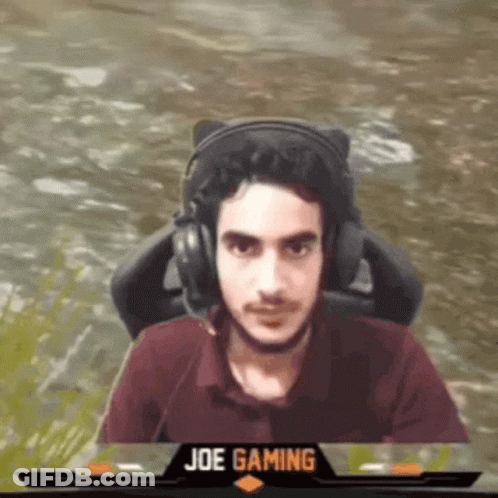 Man Wearing Headphones Sitting In Front Of Joe Gaming Logo GIF