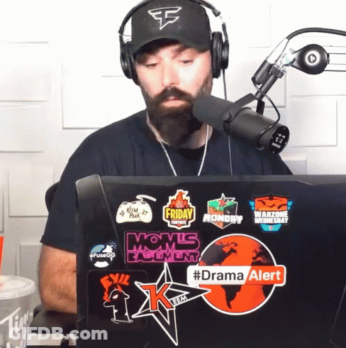 Man Wearing Headphones Sitting In Front Of Laptop With Dramaalert Sticker GIF