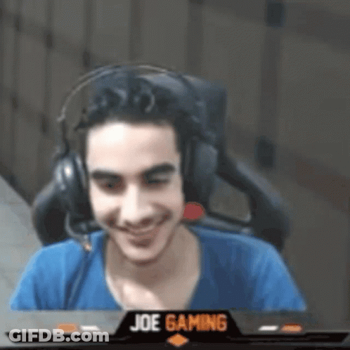 Man Wearing Headphones Sitting In Front Of Screen Saying Joe Gaming GIF