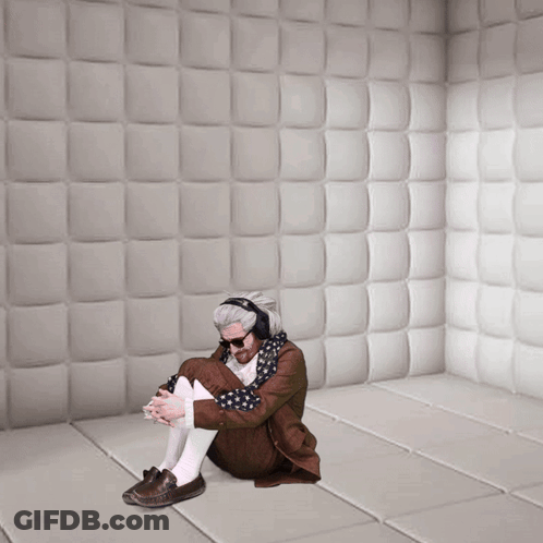 Man Wearing Headphones Sitting On Floor GIF
