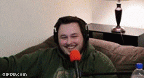 Man Wearing Headphones Sitting With Microphone GIF