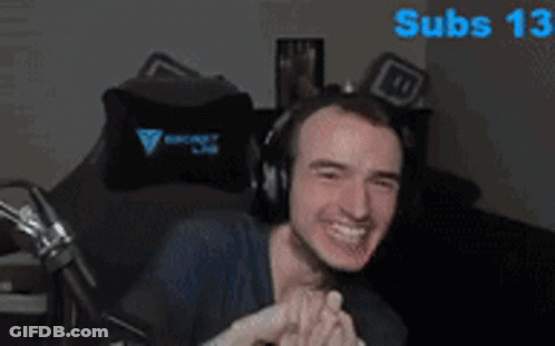 Man Wearing Headphones Sitting With Subs 13 Behind GIF