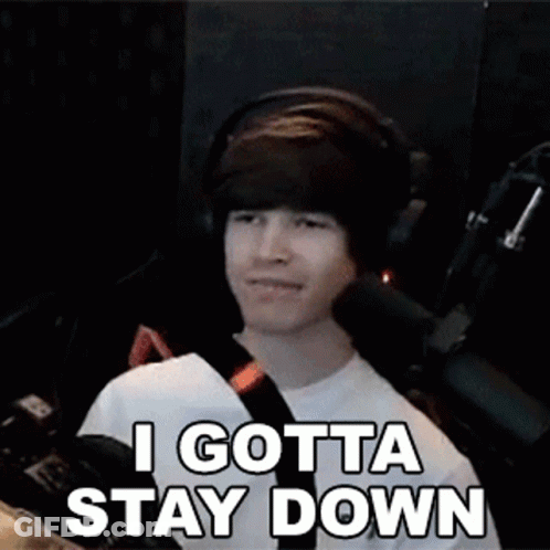 Man Wearing Headphones Smiling And Saying I Gotta Stay Down GIF