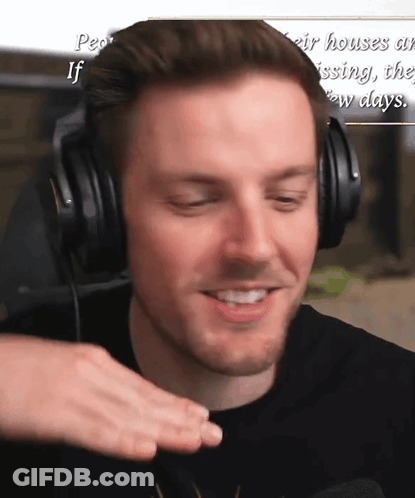 Man Wearing Headphones Smiling In Front Of Sign People's Houses Are Missing GIF