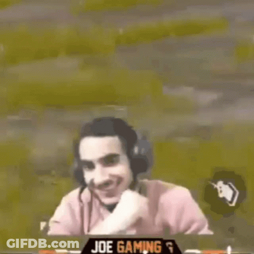 Man Wearing Headphones Smiling While Playing Video Game GIF