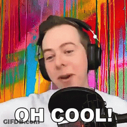 Man Wearing Headphones Standing In Front Of Microphone Saying Oh Cool GIF