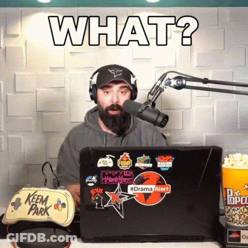 Man Wearing Headphones Stands In Front Of Microphone And Laptop Drama Alert GIF