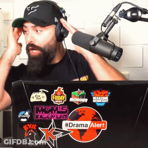 Man Wearing Headphones Stands In Front Of Microphone And Laptop With #Dramaalert GIF
