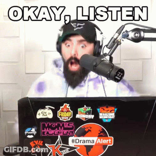 Man Wearing Headphones Stands In Front Of Microphone Saying Okay Listen GIF