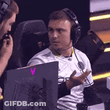 Man Wearing Headphones Talking To Another GIF