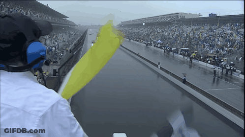 Man Wearing Headphones Watching Race GIF