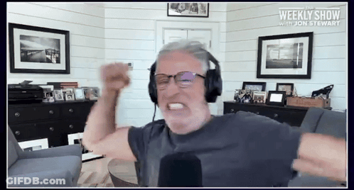 Man Wearing Headphones Weekly Show With Jon Stewart GIF