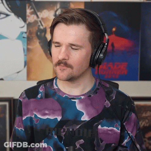 Man Wearing Headphones With Blade Runner Poster GIF