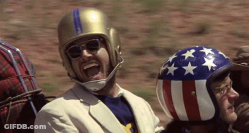 Man Wearing Helmet And Sunglasses Laughing GIF