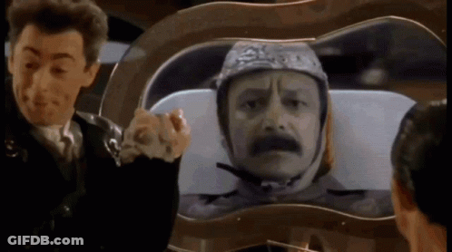Man Wearing Helmet Looking At Another GIF