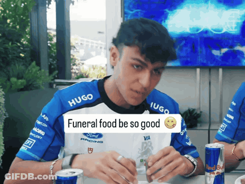 Man Wearing Hugo Shirt Eating GIF