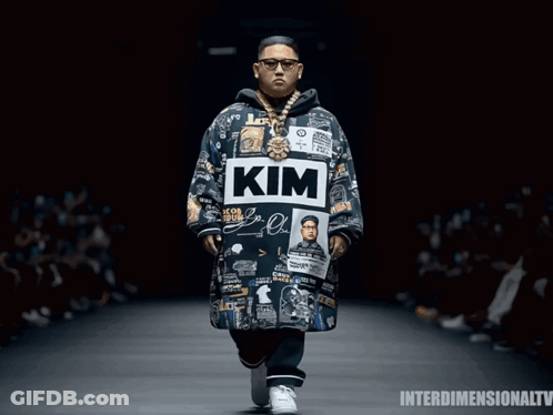 Man Wearing Jacket Saying Kim On Runway GIF