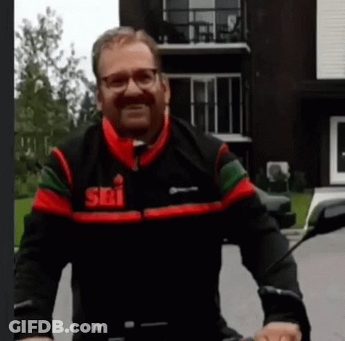 Man Wearing Jacket That Says Sri Riding Motorcycle GIF