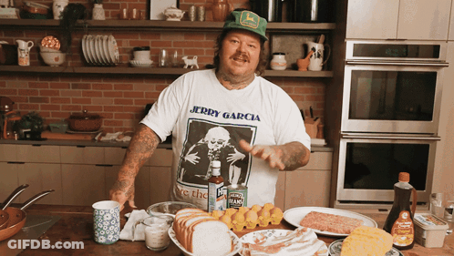 Man Wearing Jerry Garcia T-Shirt Standing In Kitchen GIF