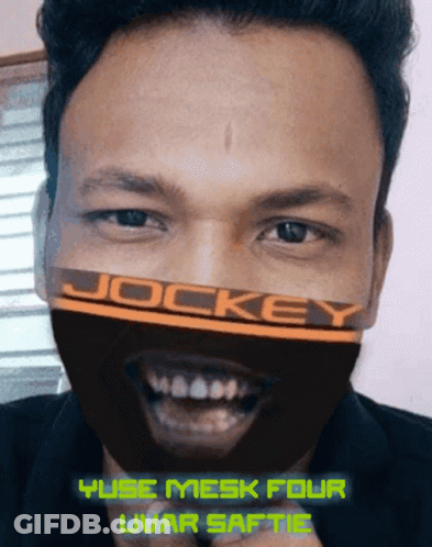 Man Wearing Jockey Mask Smiling GIF