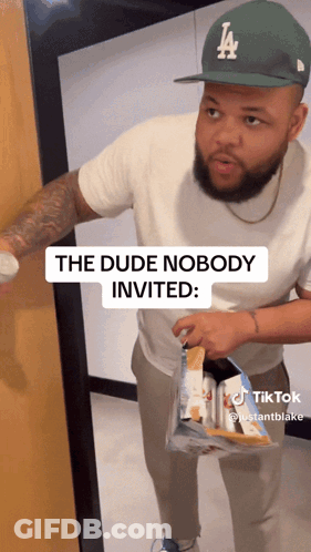 Man Wearing LA Hat Holding Chips GIF