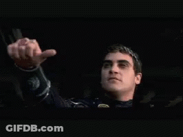 Man Wearing Laurel Wreath Giving Thumbs Down GIF