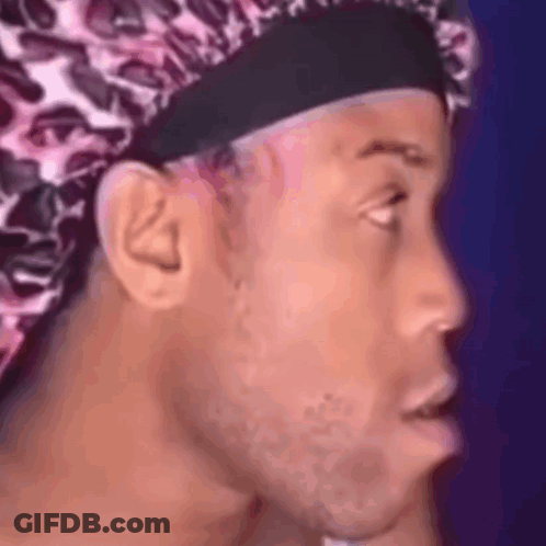 Man Wearing Leopard Print Hat Making Funny Face GIF