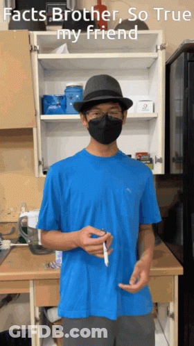 Man Wearing Mask And Hat In Front Of Facts Brother Cabinet GIF