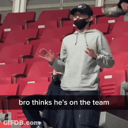 Man Wearing Mask In Stadium With Bro Thinks He's On The Team GIF