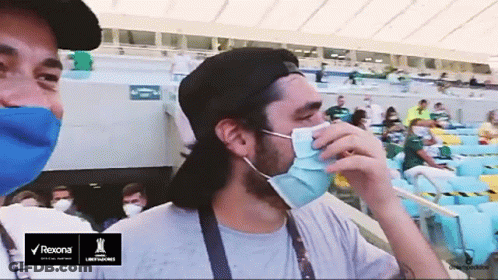 Man Wearing Mask In Stadium With Rexona Logo GIF