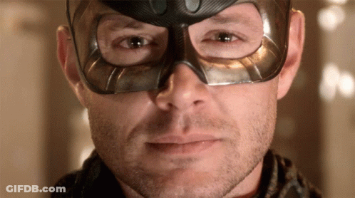 Man Wearing Mask Looking At Camera GIF