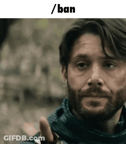 Man Wearing Mask Looks At Camera GIF