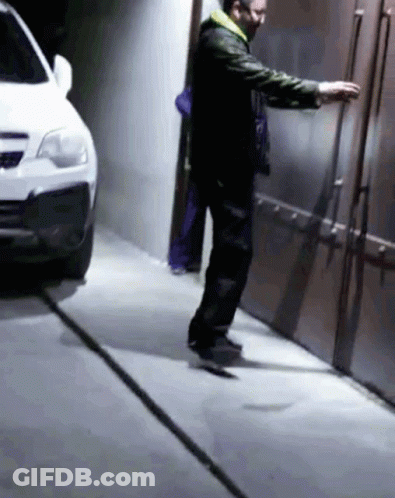 Man Wearing Mask Next To Car GIF