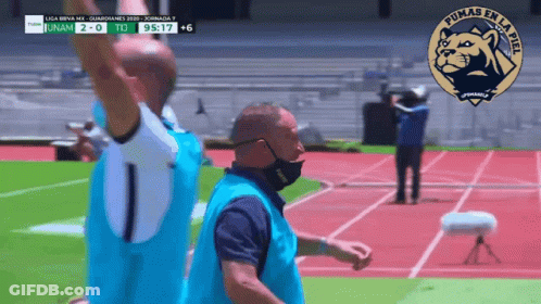 Man Wearing Mask On Track With Pumas Logo GIF
