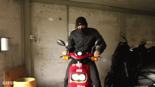 Man Wearing Mask Riding Red Scooter GIF