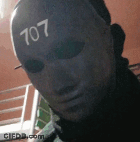 Man Wearing Mask With Number 707 GIF
