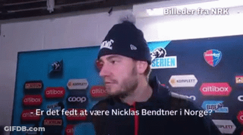 Man Wearing Nike Beanie In Front Of Bildeder Fra Nrk Sign GIF