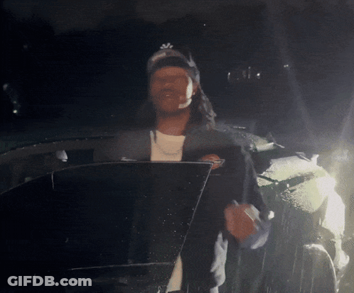 Man Wearing NY Hat Standing In Front Of Car GIF