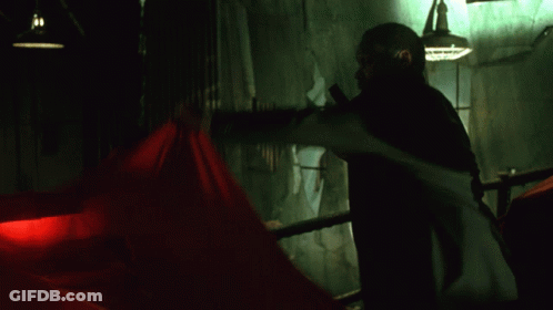 Man Wearing Puppet Mask With Red Bow Tie GIF