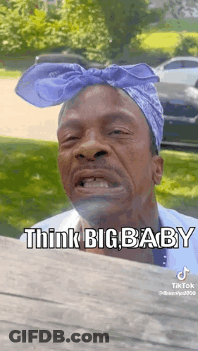 Man Wearing Purple Bandana Making Funny Face GIF