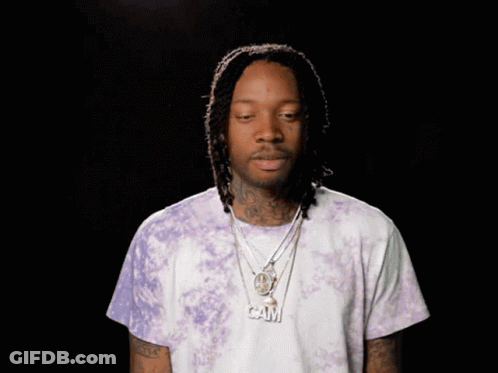 Man Wearing Purple Tie Dye Shirt And Cam Necklace GIF