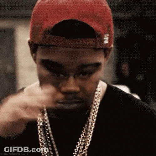 Man Wearing Red Hat And Chains Making Face GIF