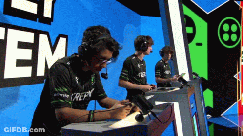 Man Wearing Repy Shirt At Desk GIF