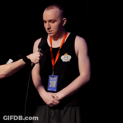 Man Wearing Stop Me Lanyard Interviewed GIF