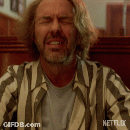 Man Wearing Striped Shirt With Netflix Logo GIF